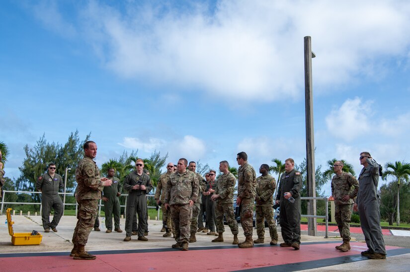 Airmen from the 15th Airlift Squadron receive instructions