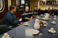 MEDITERRANEAN SEA (Dec. 5, 2022) Cmdr. Peter Flynn, commanding officer of USS Arleigh Burke, left, hosts Rear Adm. Christophe Cluzel, commander of the French Maritime Force and the French carrier strike group, in the Wardroom during a tour of the ship, Dec. 5, 2022. Arleigh Burke is on a scheduled deployment in the U.S. Naval Forces Europe area of operations, employed by U.S. Sixth Fleet to defend U.S., allied and partner interests. (U.S. Navy photo by Ensign Benjamin Cusimano)