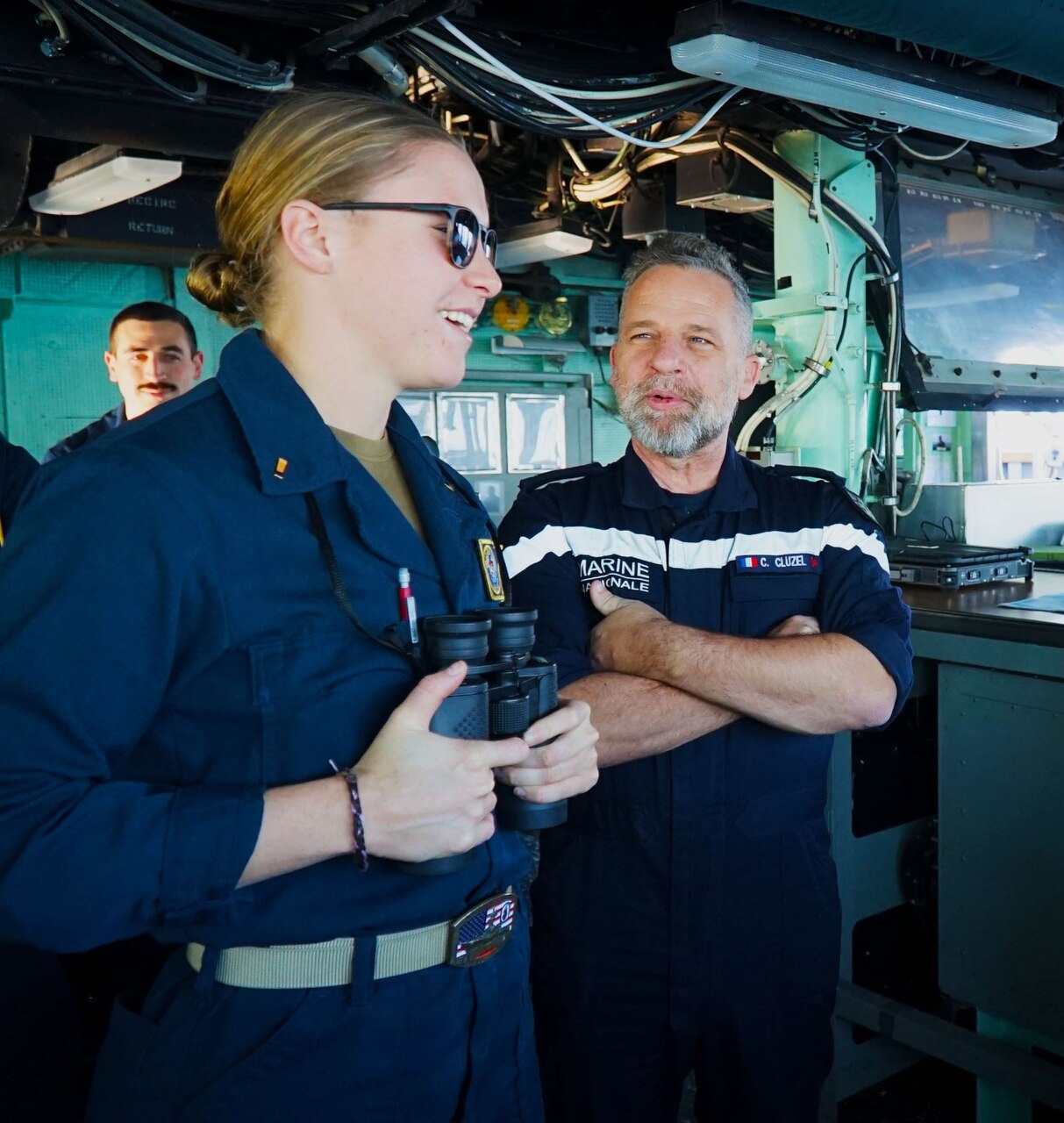 MEDITERRANEAN SEA (Dec. 5, 2022) Ensign Bray Zimmerman, Operations Intelligence Division Officer aboard the Arleigh Burke-class guided-missile destroyer USS Arleigh Burke (DDG 51), left, shows Rear Admiral Christophe Cluzel, commander of the French Maritime Force and the French carrier strike group, the Pilot House during a ship’s tour, Dec. 5, 2022. Arleigh Burke is on a scheduled deployment in the U.S. Naval Forces Europe area of operations, employed by U.S. Sixth Fleet to defend U.S., allied and partner interests. (U.S. Navy photo by Ensign Benjamin Cusimano)