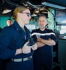 MEDITERRANEAN SEA (Dec. 5, 2022) Ensign Bray Zimmerman, Operations Intelligence Division Officer aboard the Arleigh Burke-class guided-missile destroyer USS Arleigh Burke (DDG 51), left, shows Rear Admiral Christophe Cluzel, commander of the French Maritime Force and the French carrier strike group, the Pilot House during a ship’s tour, Dec. 5, 2022. Arleigh Burke is on a scheduled deployment in the U.S. Naval Forces Europe area of operations, employed by U.S. Sixth Fleet to defend U.S., allied and partner interests. (U.S. Navy photo by Ensign Benjamin Cusimano)