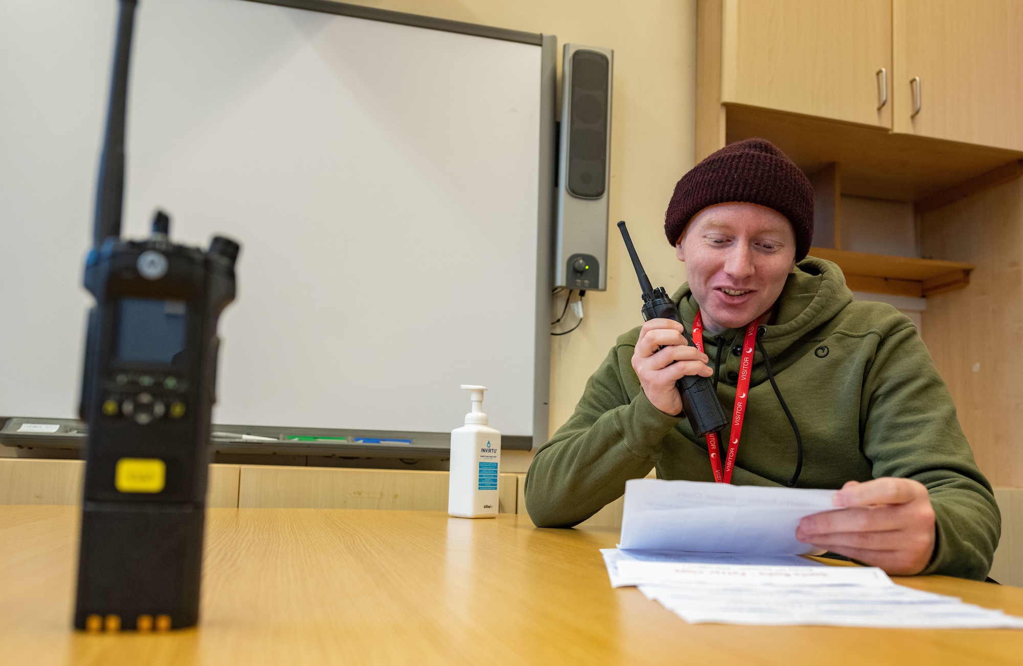 Staff Sgt. Cameron Blosser, 100th Communications Squadron radio frequency systems supervisor, communicates over land mobile radios with students at Beck Row Primary Academy