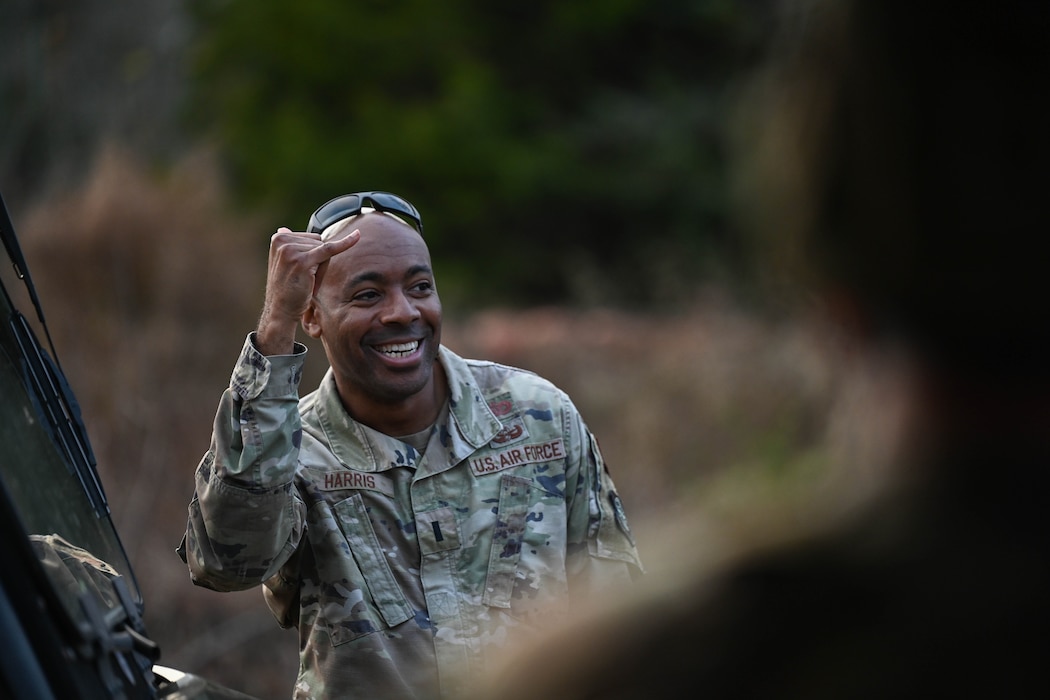 An Airman puts his fist in the air in celebration.