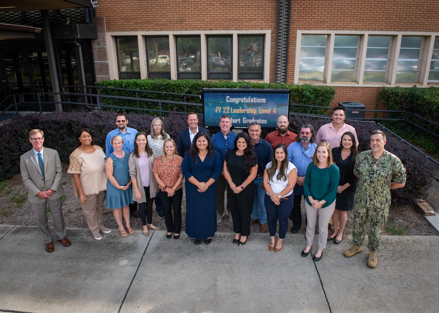 Congratulations to the Naval Surface Warfare Center Panama City Division Fiscal Year 2022 Leadership Level 4 Development Program cohort who stand with (right) NSWC PCD Commanding Officer Capt. David Back and (left) NSWC PCD Technical Director Dr. Peter Adair. LL4 graduates are Katherine Mapp, Peter Halvorson, Brett Troia, Carmelita Martin, David Hawes, Brian Brock, Monica Queen, Dr. Michelle Kincer, Amanda Bobe, Christopher Harrington, Tinsley Ihaksi, Rosa Eby, Stacy Faison, Samantha Snellen, Amanda Elkins, Joy St Amant, Robert Worcester, Shiva Singh, Jonathan Outlaw, and Phillip Allen. (U.S. Navy photo by Anthony Powers)