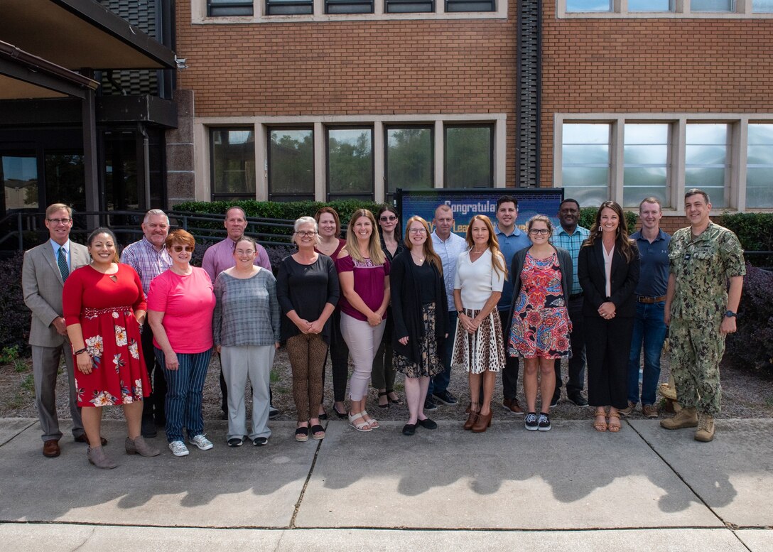 Congratulations to the Naval Surface Warfare Center Panama City Division Fiscal Year 2022 Leadership Level 3 Development Program cohort who stand with (right) NSWC PCD Commanding Officer Capt. David Back and (left) NSWC PCD Technical Director Dr. Peter Adair. LL3 graduates are Julia Lewis, Matthew Strickland, Shauna Love-vonKnoblauch, Mike Sumpter, Adrienne Brooks, Brandon Winkler, Jessica Gutierrez, Ronald Morton, Whitney Gillman, Angela Hall, Sarah Dorman, Kendra Wardlow, Frances Negron, Ilish Kane, Jennifer Stallard, Michael Beard, Roscelin Figueroa, Brandy Lewis, James Burks, and Cory Bruckschen. (U.S. Navy photo by Anthony Powers)