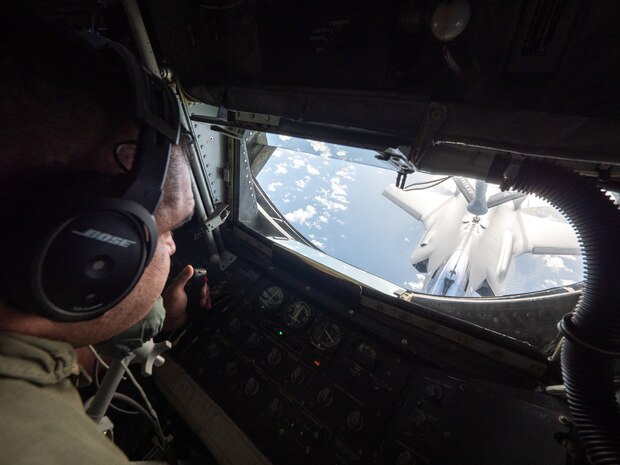 U.S. Air Force Senior Master Sgt. Noa Morse, 203rd Air Refueling Squadron boom operator, delivers fuel to Royal Australian Air Force aircraft December 8, 2022, near the coast of Oahu, Hawaii.