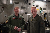 2 men pose for a photo