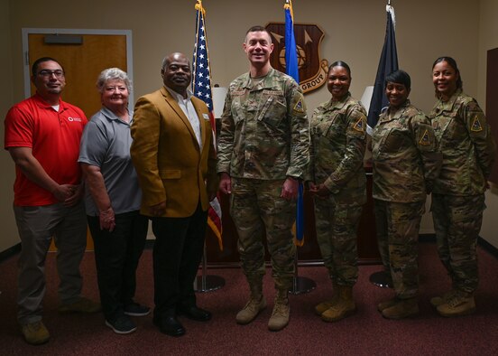 The Col. Brent Cunningham, 30th Medical Group commander, poses for a photo with his executive staff and members of the American Red Cross, Dec. 16, 2022 at Vandenberg Space Force Base, Calif. (U.S. Space Force photo by Airman 1st Class Tiarra Sibley)