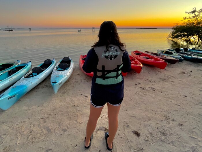 U.S. Air Force Senior Airman Dakota Raub, Space Launch Delta 45 public affairs specialist, watches the sunset in Mims, Fla., Oct. 07, 2022. Patrick Space Force Base Outdoor Recreation offered bioluminescent kayaking tours to Airmen and Guardians through their Recharge for Resiliency program. (Courtesy Photo)