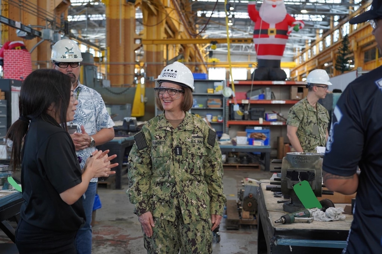 PEARL HARBOR, Hawaii (December 14, 2022) Vice Chief of Naval Operations Admiral Lisa Franchetti meets with a shipyard worker at Pearl Harbor Naval Shipyard & Intermediate Maintenance Facility (PHNSY & IMF) during a visit for an operations update and Shipyard Infrastructure Optimization Program (SIOP) tour onboard Joint Base Pearl Harbor-Hickam.