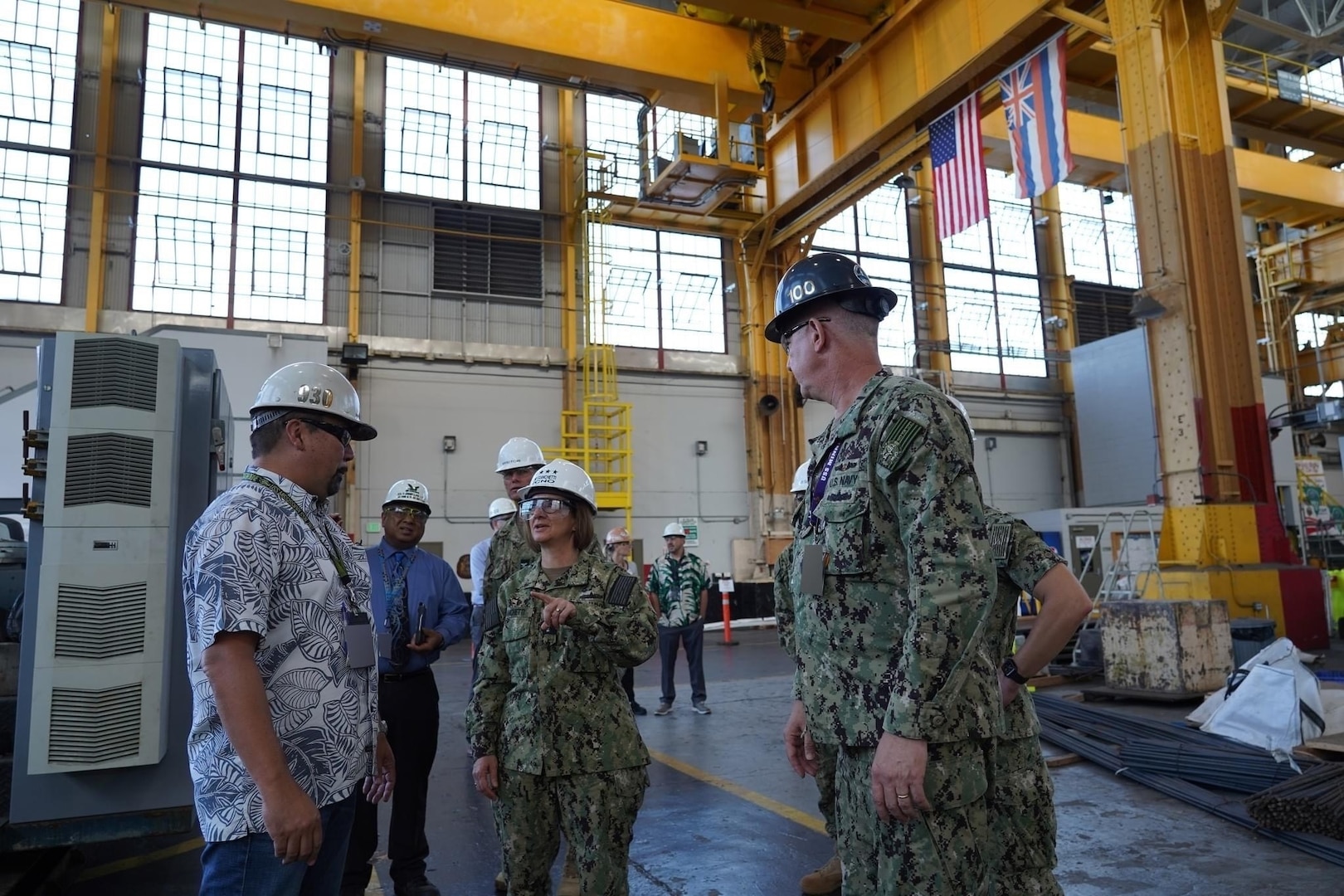 PEARL HARBOR, Hawaii (December 14, 2022) Vice Chief of Naval Operations Admiral Lisa Franchetti meets with a shipyard worker at Pearl Harbor Naval Shipyard & Intermediate Maintenance Facility (PHNSY & IMF) during a visit for an operations update and Shipyard Infrastructure Optimization Program (SIOP) tour onboard Joint Base Pearl Harbor-Hickam.