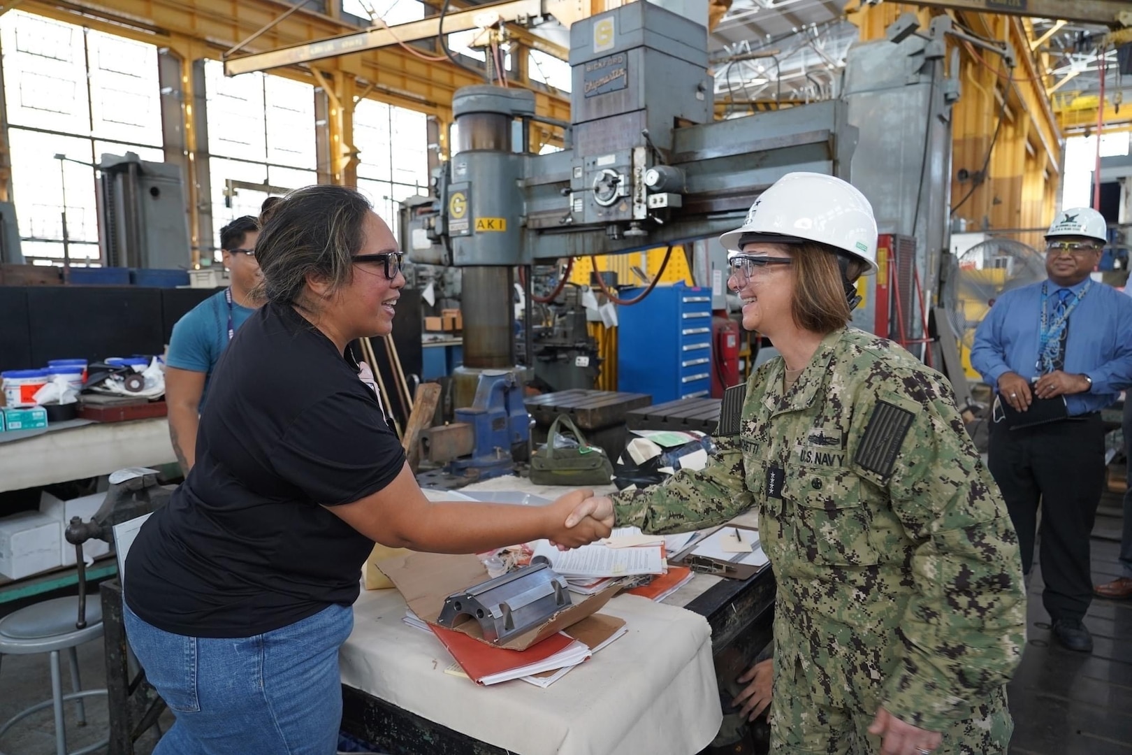 PEARL HARBOR, Hawaii (December 14, 2022) Vice Chief of Naval Operations Admiral Lisa Franchetti meets with a shipyard worker at Pearl Harbor Naval Shipyard & Intermediate Maintenance Facility (PHNSY & IMF) during a visit for an operations update and Shipyard Infrastructure Optimization Program (SIOP) tour onboard Joint Base Pearl Harbor-Hickam.