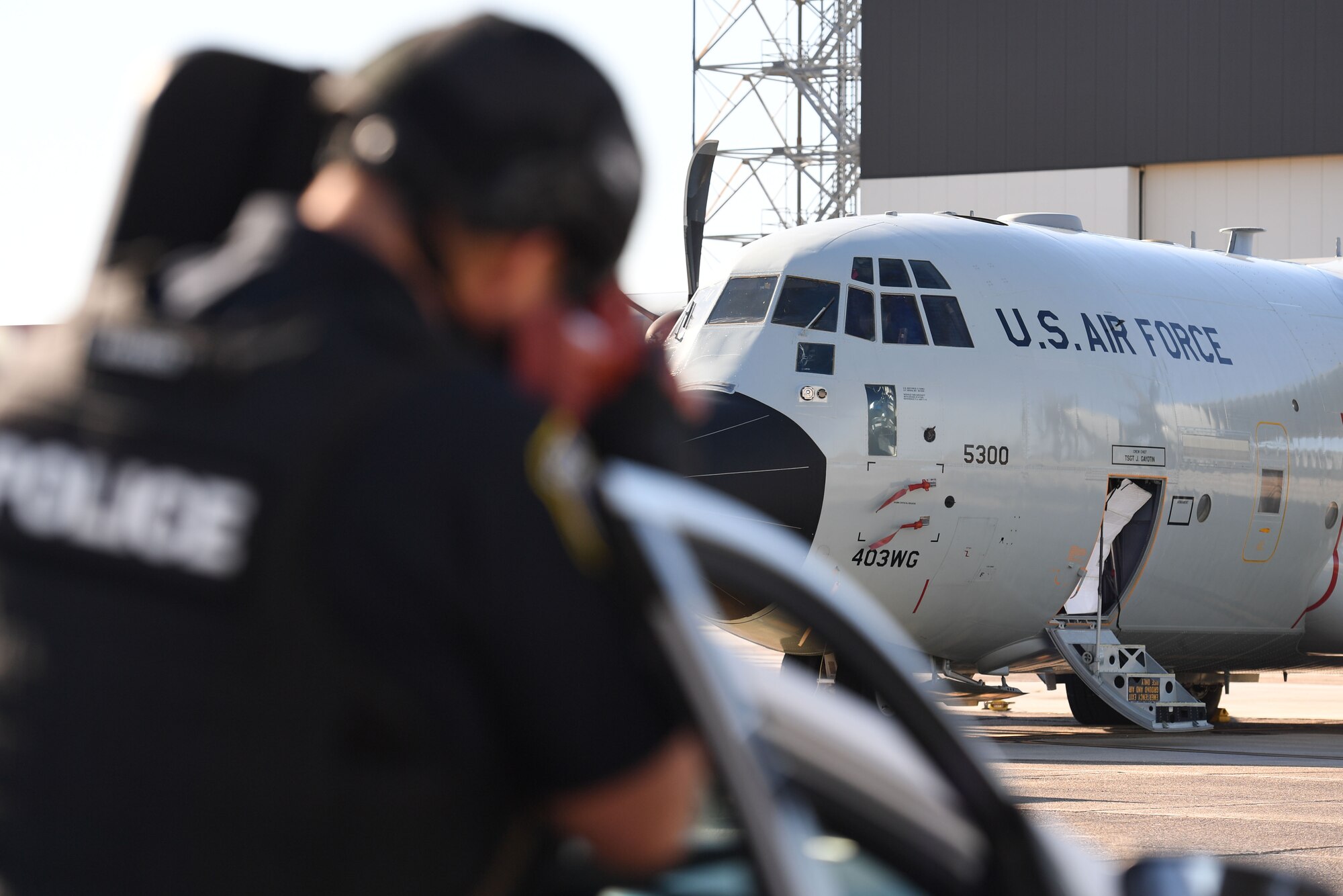 Officer Adam Barnes, 81st Security Forces Squadron patrolman, provides security on scene during a hijacking exercise at Keesler Air Force Base, Mississippi, Dec. 15, 2022.