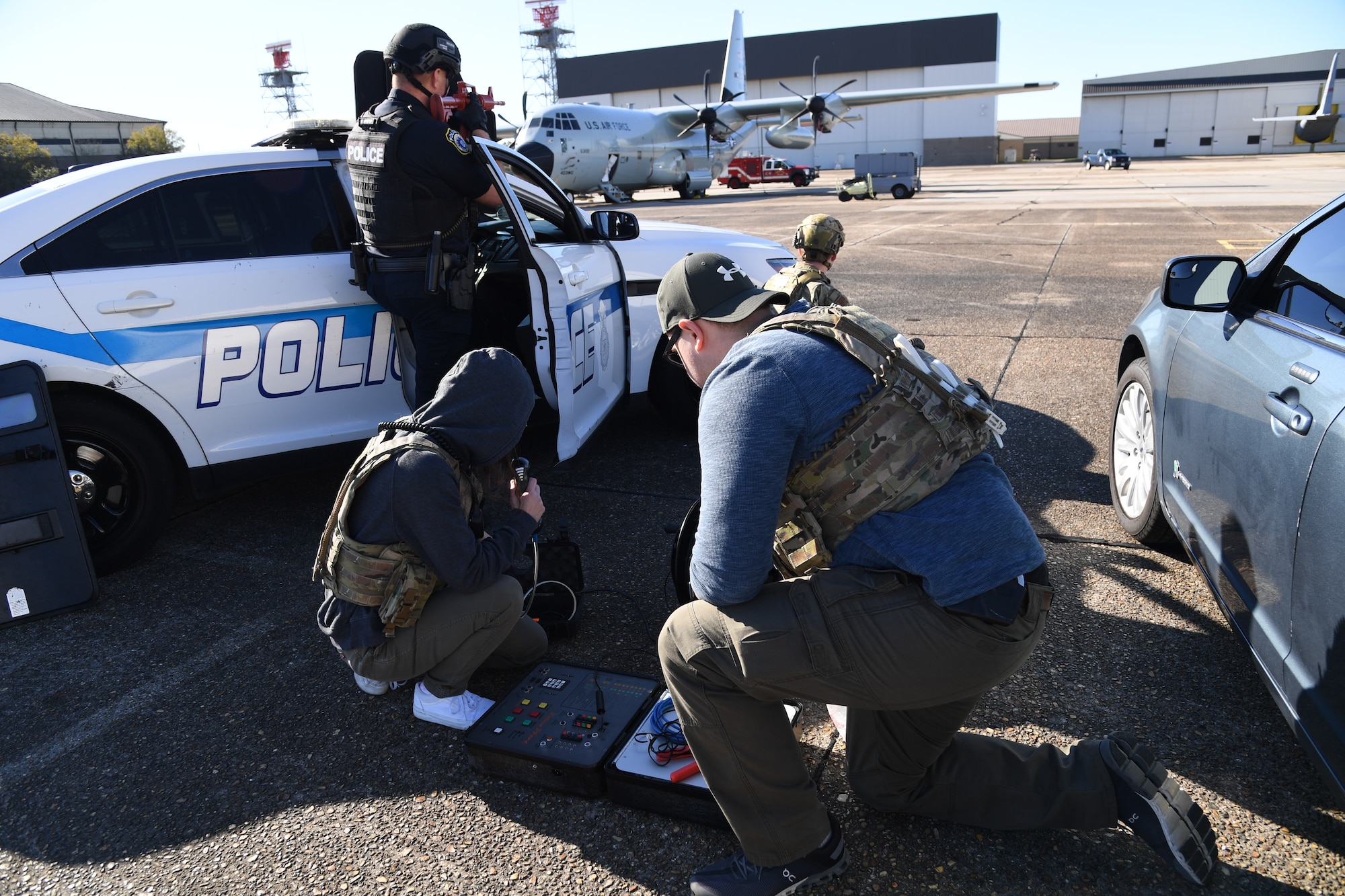 Members of the 81st Security Forces Squadron provide security and negotiations during a hijacking exercise in Woolmarket, Mississippi, Dec. 15, 2022.