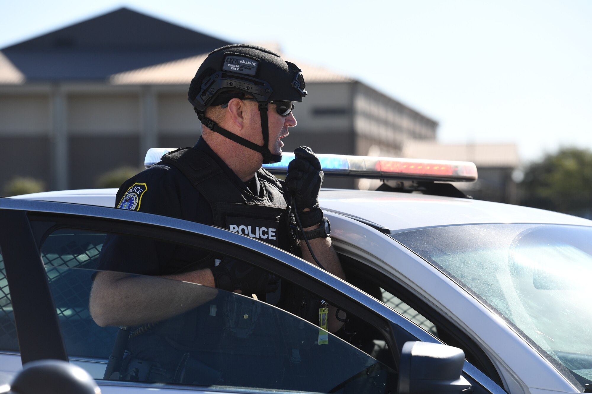 Officer Adam Barnes, 81st Security Forces Squadron patrolman, reports information to the incident commander while on scene during a hijacking exercise at Keesler Air Force Base, Mississippi, Dec. 15, 2022.