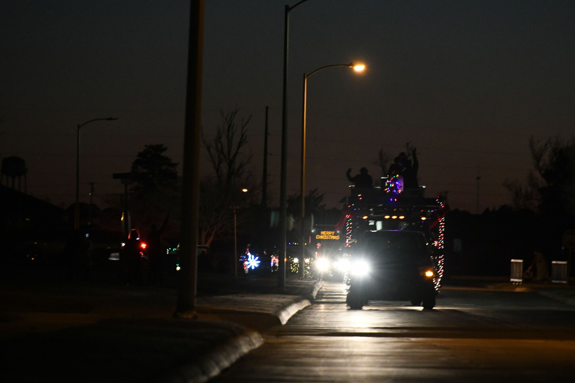 Airmen from the 97th Air Mobility Wing participate in a holiday parade at Altus Air Force base, Oklahoma, Dec. 13, 2022. More than 1,500 Airmen and families observed the event. (U.S. Air Force photo by Airman 1st Class Miyah Gray)