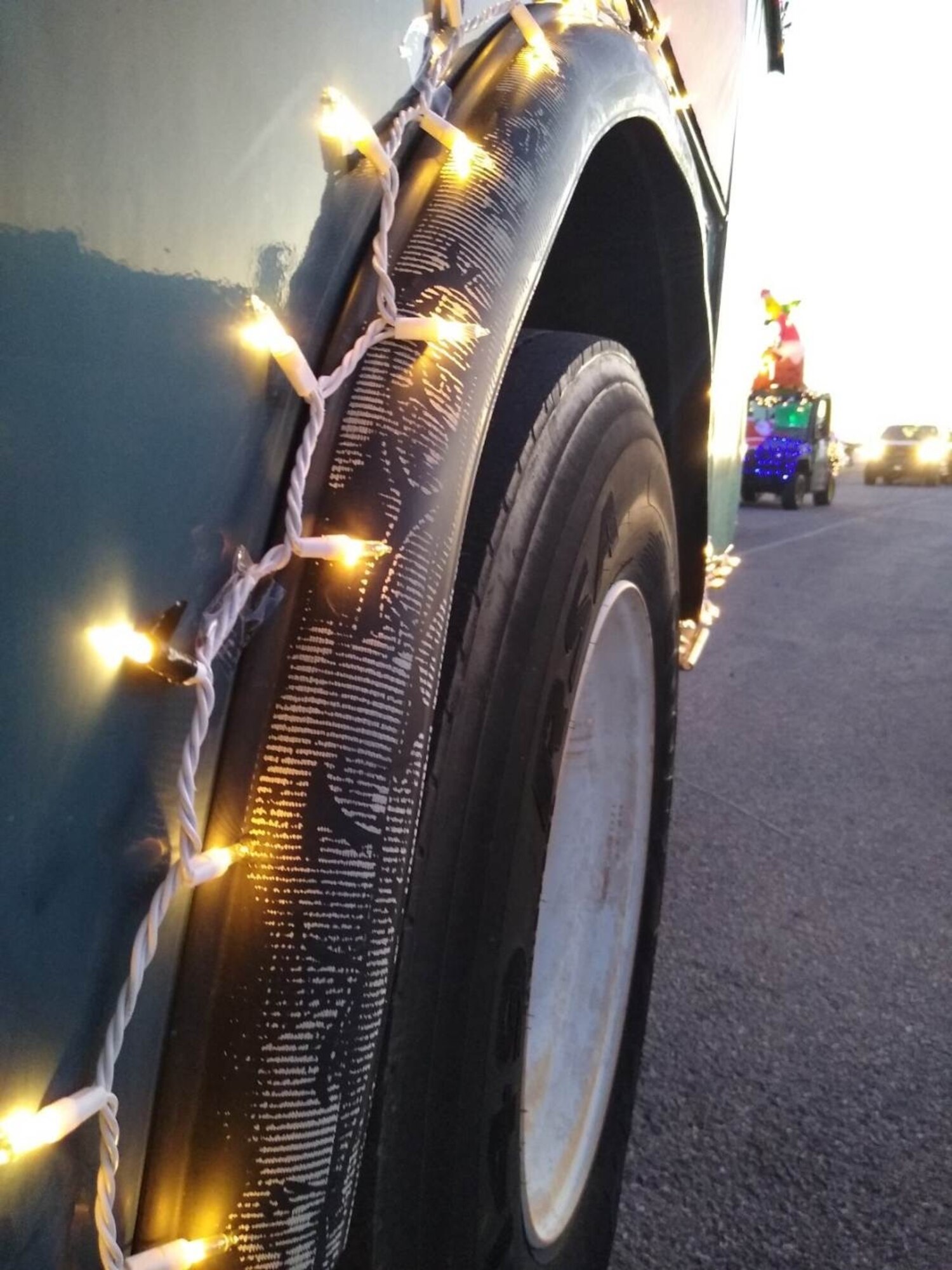 Lights are shown on the wheel of a truck during a Christmas Parade at Altus Air Force Base, Oklahoma, Dec. 13, 2022. Nineteen vehicles were decorated to participate in the parade. (Courtesy photo by Christine Brindle)