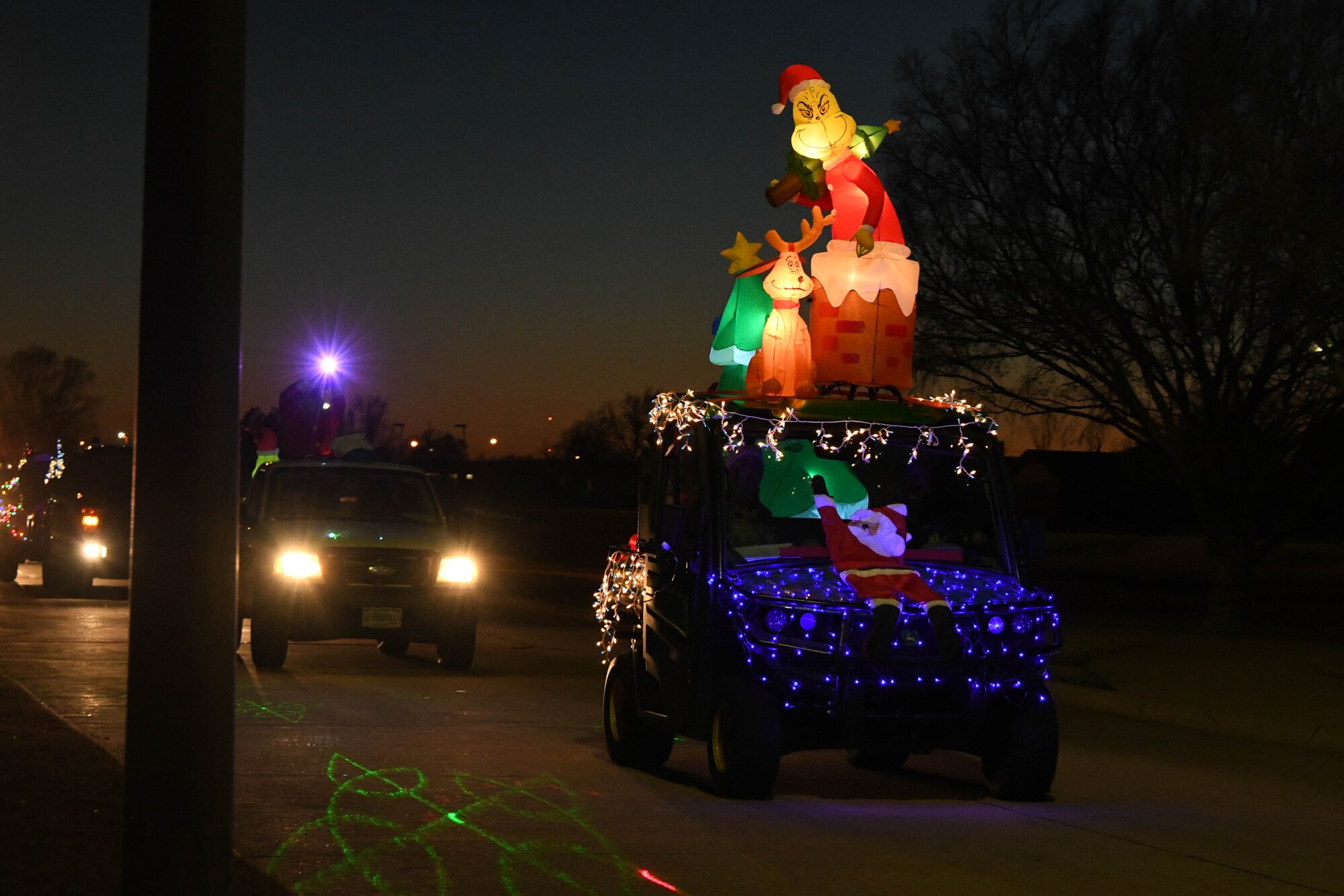 A lighted float is shown during a holiday parade and float contest at Altus Air Force Base, Oklahoma, Dec. 13, 2022. This float was decorated by members of the 97th Civil Engineer Squadron’s operations flight and won “Best Small Float” in the overall competition. (U.S. Air Force photo by Airman 1st Class Miyah Gray)