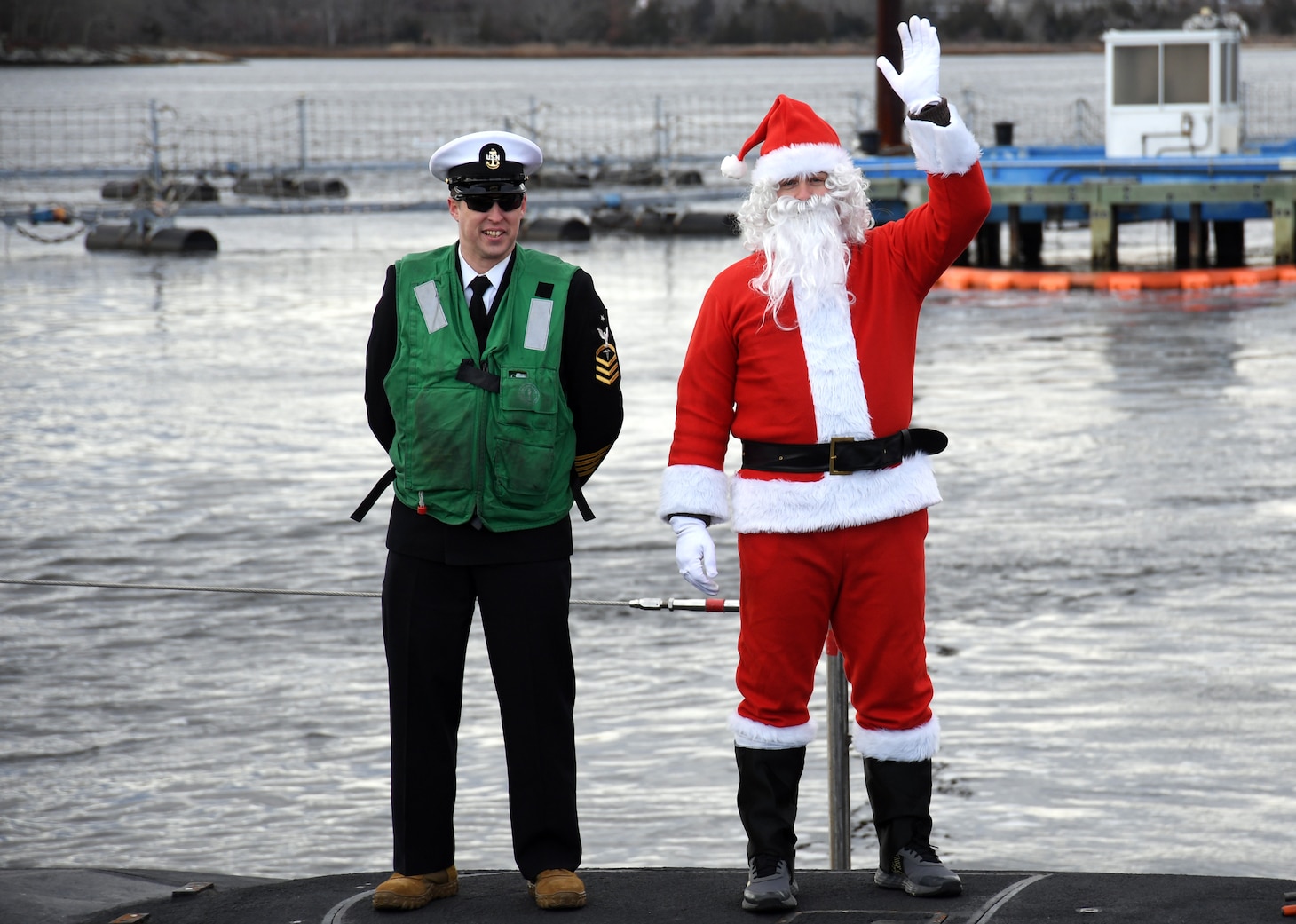 Santa Claus waves onboard the USS South Dakota (SSN 790) during a homecoming event at Naval Submarine Base New London in Groton, Conn., Dec. 18. South Dakota returned to homeport after a five-month deployment in support of the chief of naval operations’ maritime strategy. The Virginia-class fast-attack submarine USS South Dakota and crew operate under Submarine Squadron (SUBRON) FOUR and its primary mission is to provide attack submarines that are ready, willing, and able to meet the unique challenges of undersea combat and deployed operations in unforgiving environments across the globe.
