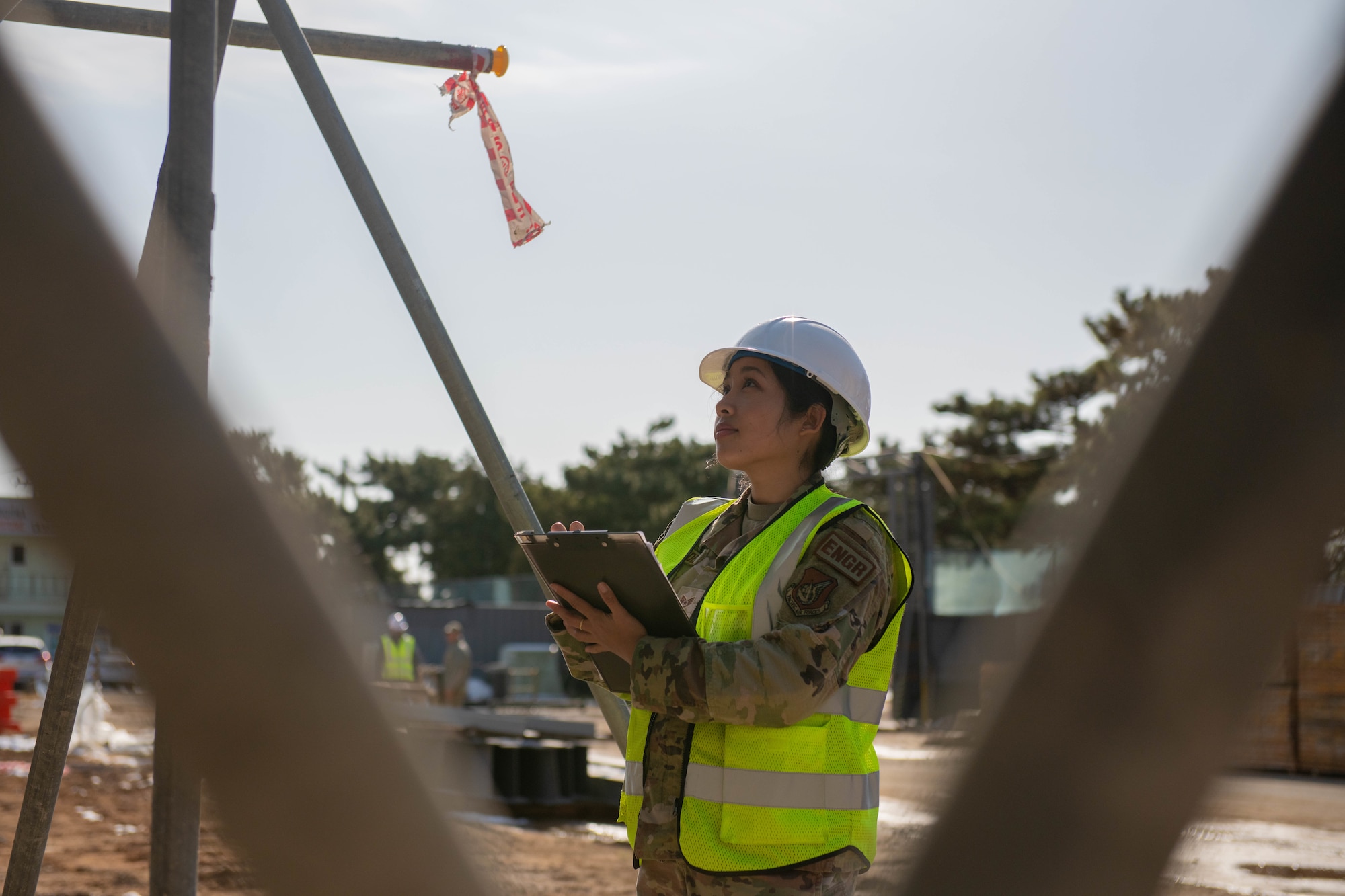 Staff Sgt. Elaine Olandez, 8th Civil Engineer Squadron construction manager, observes work at a construction site on Kunsan Air Base, Republic of Korea, Dec. 15, 2022. Olandez was selected as a recent ‘Pride of the Pack,’ an 8th Fighter Wing program that recognizes the achievements of Wolf Pack Airmen. (U.S. Air Force photo by 1st Lt. Cameron Silver)