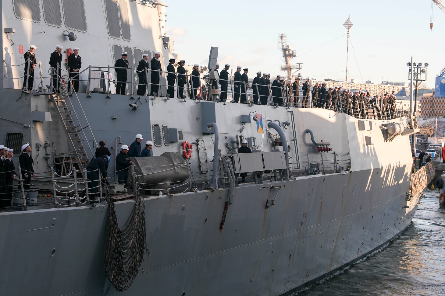 YOKOSUKA, Japan (Dec. 19, 2022) Sailors aboard the Arleigh Burke-class guided-missile destroyer USS Shoup (DDG 86) moor the ship as it arrives at Commander, Fleet Activities Yokosuka (CFAY) as the newest addition to Commander, Task Force (CTF) 71/Destroyer Squadron (DESRON) 15. CF 71/DESRON 15, is the Navy's largest forward-deployed DESRON and the U.S, 7th Fleet's principal surface force. (U.S. Navy photo by Mass Communication Specialist 2nd Class Zachary Grooman)