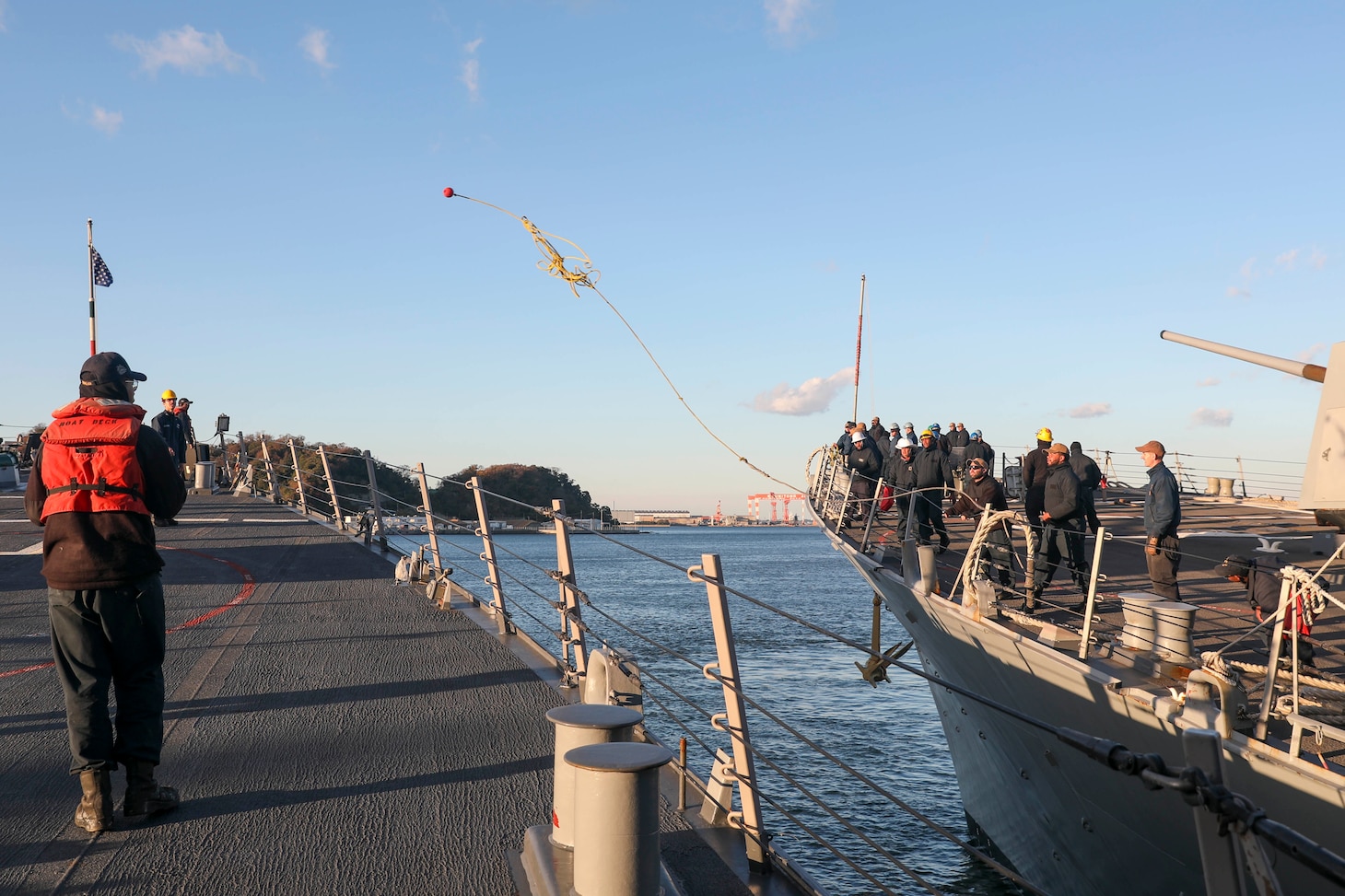 YOKOSUKA, Japan (Dec. 19, 2022) Sailors aboard the Arleigh Burke-class guided-missile destroyer USS Shoup (DDG 86) moor the ship as it arrives at Commander, Fleet Activities Yokosuka (CFAY) as the newest addition to Commander, Task Force (CTF) 71/Destroyer Squadron (DESRON) 15. CF 71/DESRON 15, is the Navy's largest forward-deployed DESRON and the U.S, 7th Fleet's principal surface force. (U.S. Navy photo by Mass Communication Specialist 2nd Class Zachary Grooman)