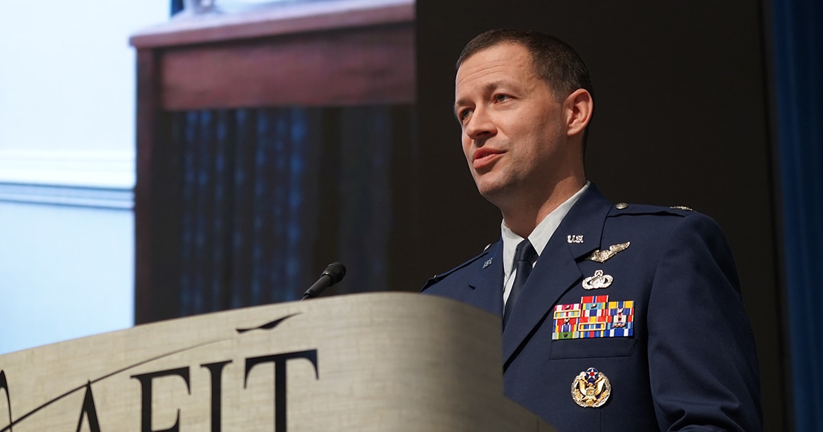 Col. Elliott Leigh, AFWERX director, speaks to the audience during a change of leadership ceremony Dec. 15, 2022, at the Air Force Institute of Technology, Wright-Patterson Air Force Base, Ohio. Leigh assumed the role of AFWERX director from Col. Nathan Diller. AFWERX is an AFRL directorate and the Department of the Air Force’s innovation arm. (U.S. Air Force photo / Michael Madero)
