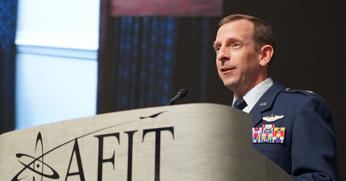 Col. Nathan Diller, former AFWERX director, speaks to the audience during a change of leadership ceremony Dec. 15, 2022, at the Air Force Institute of Technology, Wright-Patterson Air Force Base, Ohio. Col. Elliott Leigh assumed the role of AFWERX director from Diller. AFWERX is an AFRL directorate and the Department of the Air Force’s innovation arm. (U.S. Air Force photo / Michael Madero)