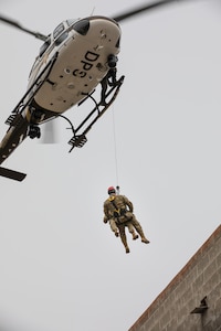 Utah National Guard members repel with the help of their civilian counterparts during a Utah National Guard FEMA Region VIII Homeland Response Force training exercise on Camp Williams, Utah, Nov. 5, 2022. The event featured multiagency interoperability training for the Utah National Guard and civilian partner agencies to provide initial and follow-on care to stranded and injured citizens in the event of a natural or human-caused emergency. (U.S. Army National Guard photo by Sgt. Alejandro Lucero)