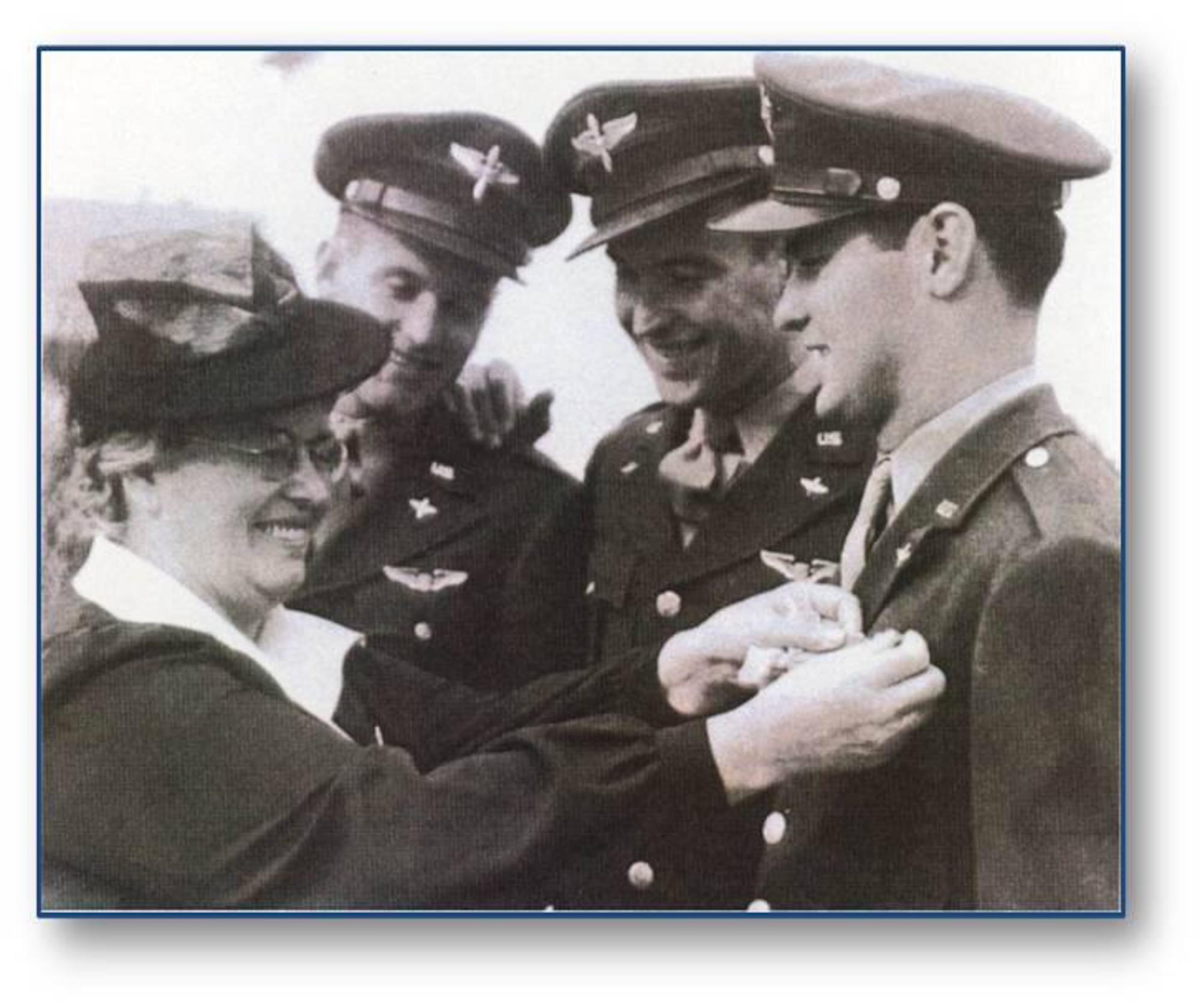 Anna McConnell pins pilot's wings on her three sons Fred, Edwin and Thomas. In 1954, Wichita Air Force Base was formally renamed to McConnell AFB in honor of Fred and Thomas, who both died while serving. In 1999, base officials added Edwin's name to the installation after his death. (Courtesy Photo)