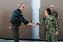 U.S. Navy Adm. Lisa Franchetti, vice chief of Naval Operations, is greeted by Jeff Telling, director of airfield operations, Marine Corps Air Station Kaneohe Bay, Marine Corps Base Hawaii, during a visit to MCBH, Dec. 13, 2022. Franchetti met with base leadership to discuss naval assets, housing, and infrastructure improvements. (U.S. Marine Corps photo by Lance Cpl. Cody Purcell)
