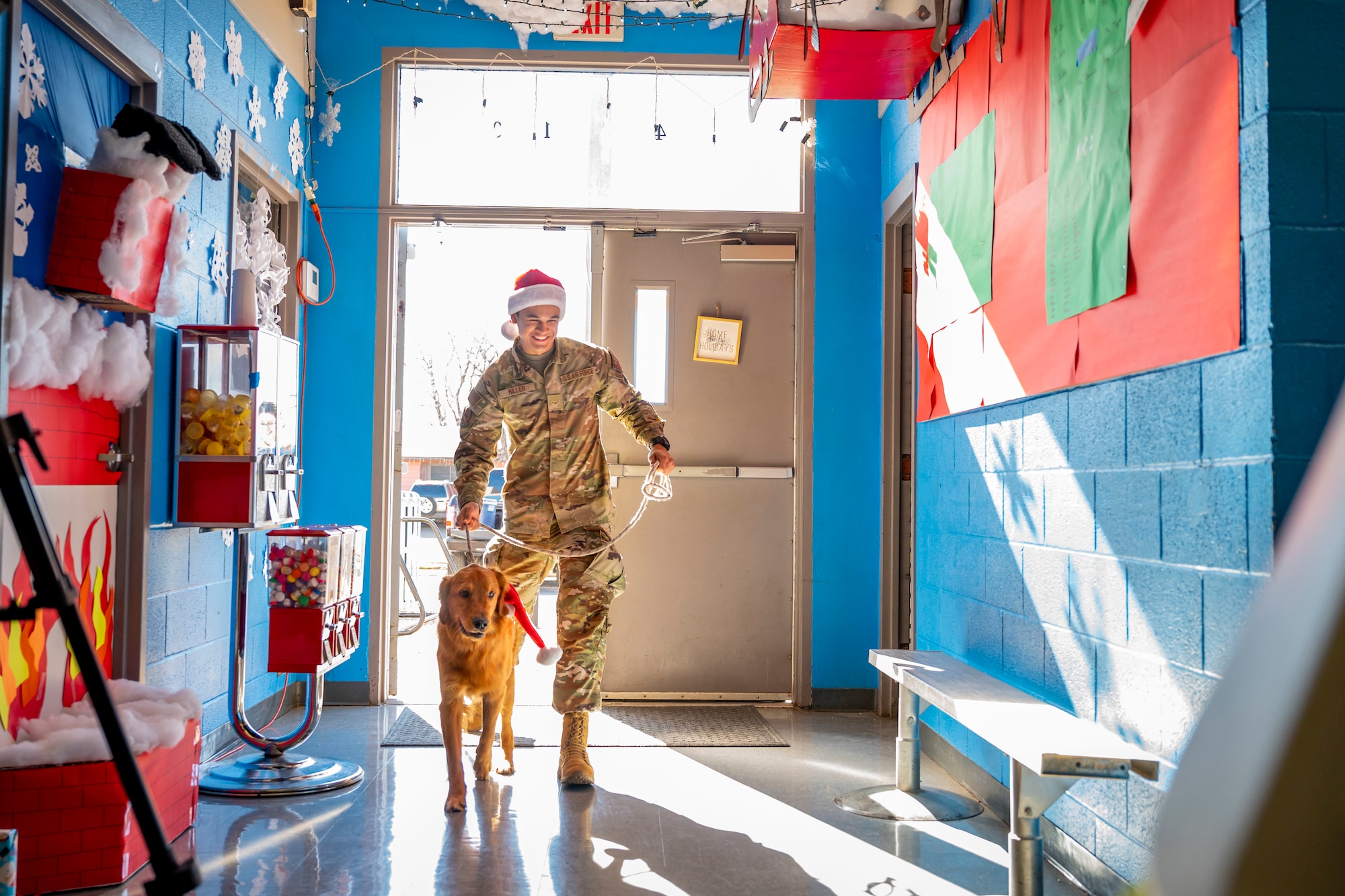 U.S. Air Force Airman Joshua Miller, 77th Weapons Squadron member, walks into the Boys and Girls Club of Abilene to help donate toys after completing the Dyess Rapid Airman Development ruck march in Abilene, Texas, Dec. 14, 2022. The RAD team carried bags of toys during the six-mile ruck march to the Boys and Girls Club of Abilene to donate them to those in need. (U.S. Air Force photo by Senior Airman Leon Redfern)