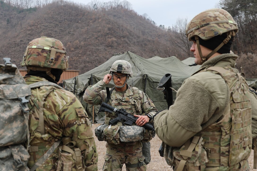 U.S. Army Maj. Dennis Kim, 121st Field Hospital, 65th Medical Brigade, prepares for the medical lane event of the Eighth Army Best Medic Competition, Camp Casey, South Korea, Dec. 06, 2022. The 8A BMC was a 72 hour competition challenging soldiers on their combat lifesaving skills in a variety of high-intensity scenarios. (U.S. Army photo by Spc. Alison Strout, 20th Public Affairs Detachment)