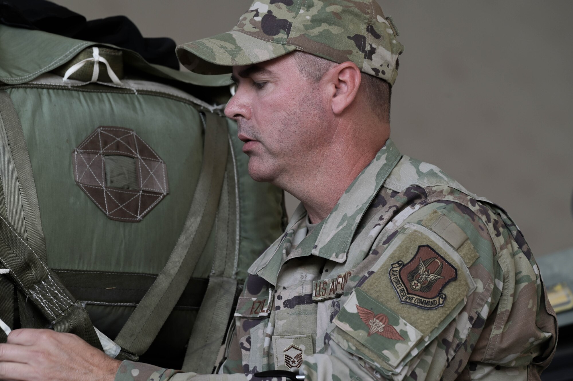 a person tightens down cargo straps