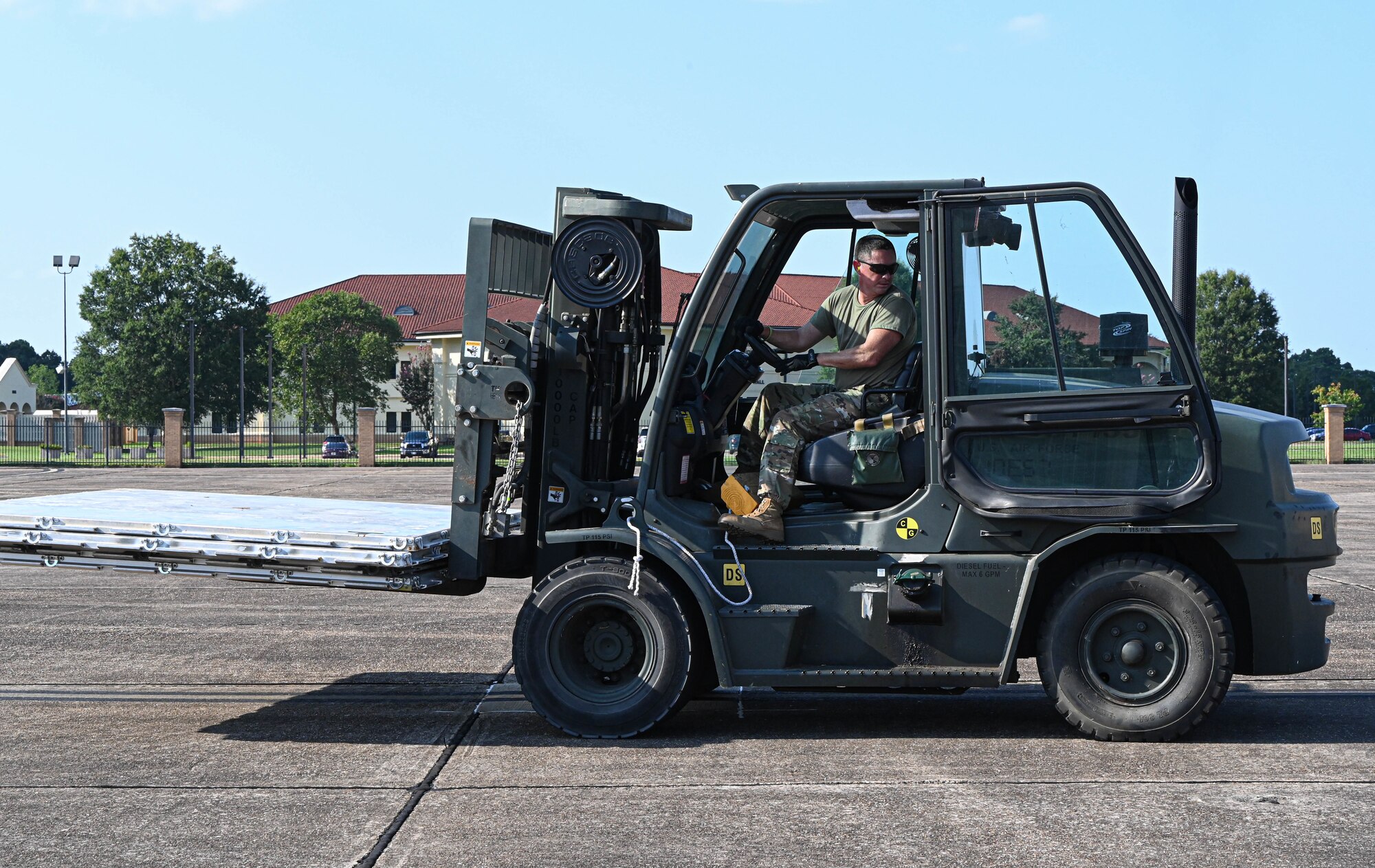 a person drives a forklift