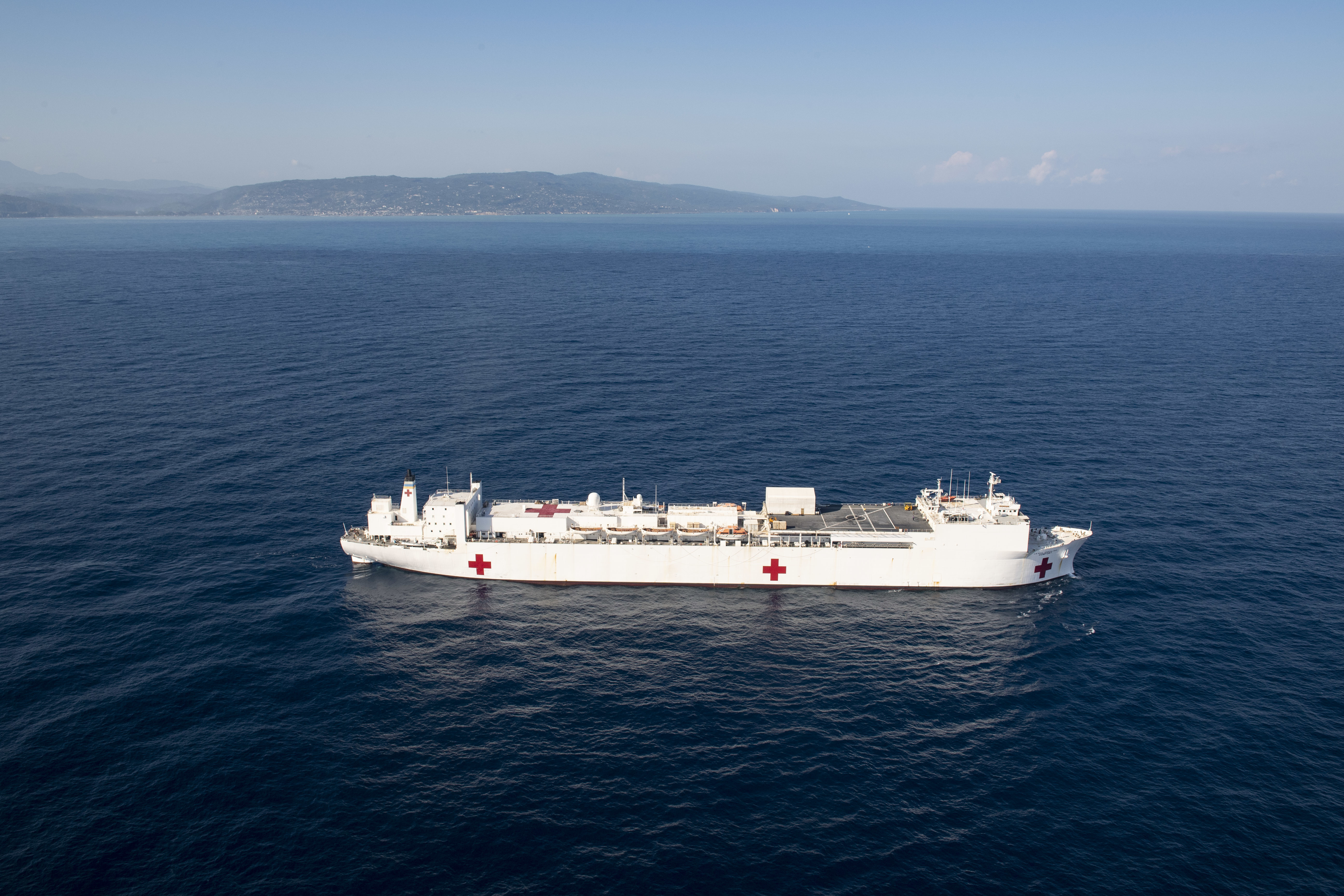 The hospital ship USNS Comfort (T-AH 20) sails off the coast of Jeremie, Haiti in support of Continuing Promise, Dec. 14, 2022.