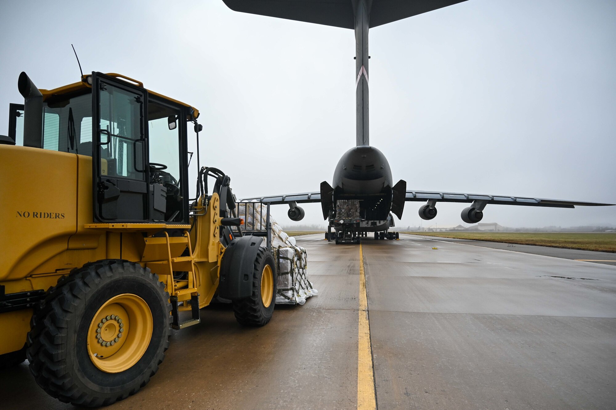 Airmen from the 72nd Logistics Readiness Squadron and the 72nd Aerial Port Squadron palatize and load over 130 thousand pounds of food and medical humanitarian aid onto a C-5 Galaxy bound for Costa Rica December 8, 2022, Tinker Air Force Base, Oklahoma. Humanitarian operations like this one happen multiple times a year in partnership with the State Department to bring aid all over the world.