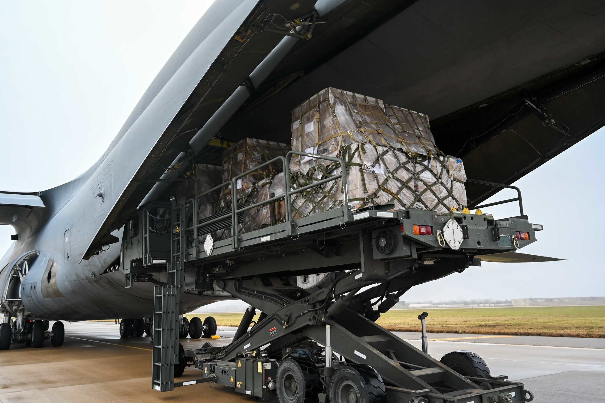 Airmen from the 72nd Logistics Readiness Squadron and the 72nd Aerial Port Squadron palatize and load over 130 thousand pounds of food and medical humanitarian aid onto a C-5 Galaxy bound for Costa Rica December 8, 2022, Tinker Air Force Base, Oklahoma. Humanitarian operations like this one happen multiple times a year in partnership with the State Department to bring aid all over the world.