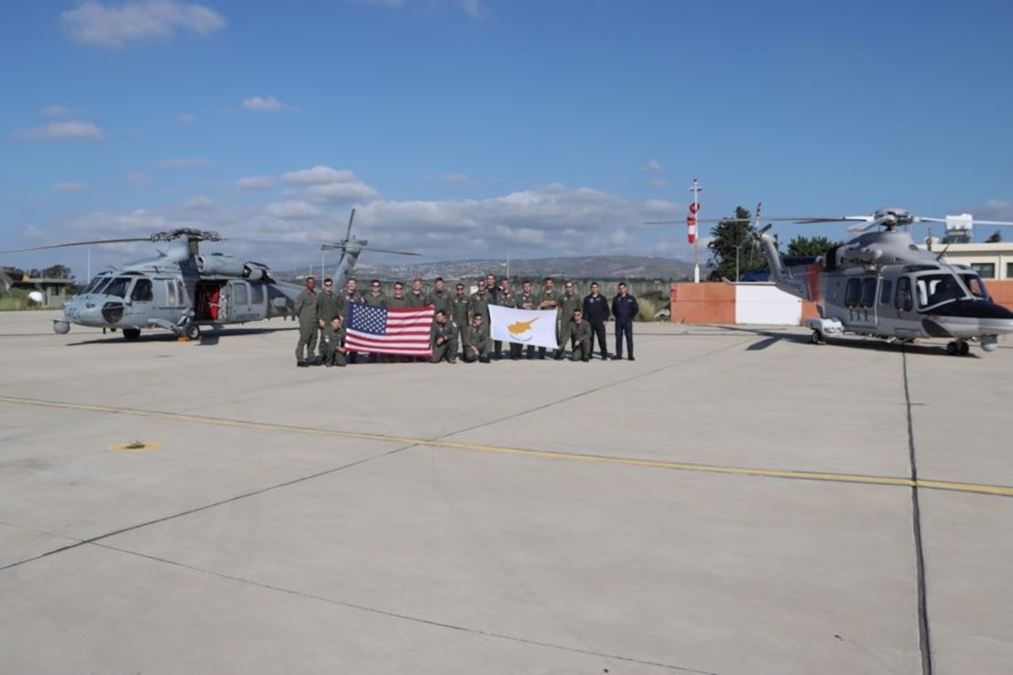 Republic of Cyprus Air Force personnel and U.S. Navy personnel assigned to the “Ghostriders” of Helicopter Sea Combat Squadron (HSC) 28 pose for a photograph following the successful completion of a bilateral search and rescue training event in the Republic of Cyprus, Dec. 16, 2022.