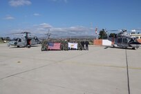 Republic of Cyprus Air Force personnel and U.S. Navy personnel assigned to the “Ghostriders” of Helicopter Sea Combat Squadron (HSC) 28 pose for a photograph following the successful completion of a bilateral search and rescue training event in the Republic of Cyprus, Dec. 16, 2022.
