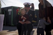 Senior Chief Machinist’s Mate Timothy Golden, assigned to the Arleigh Burke-class guided-missile destroyer USS Paul Ignatius (DDG 117), greets his family on the pier onboard Naval Station Rota, Spain, as Paul Ignatius returns home from its first Forward Deployed Naval Forces-Europe (FDNF-E) patrol, Dec. 20, 2022.