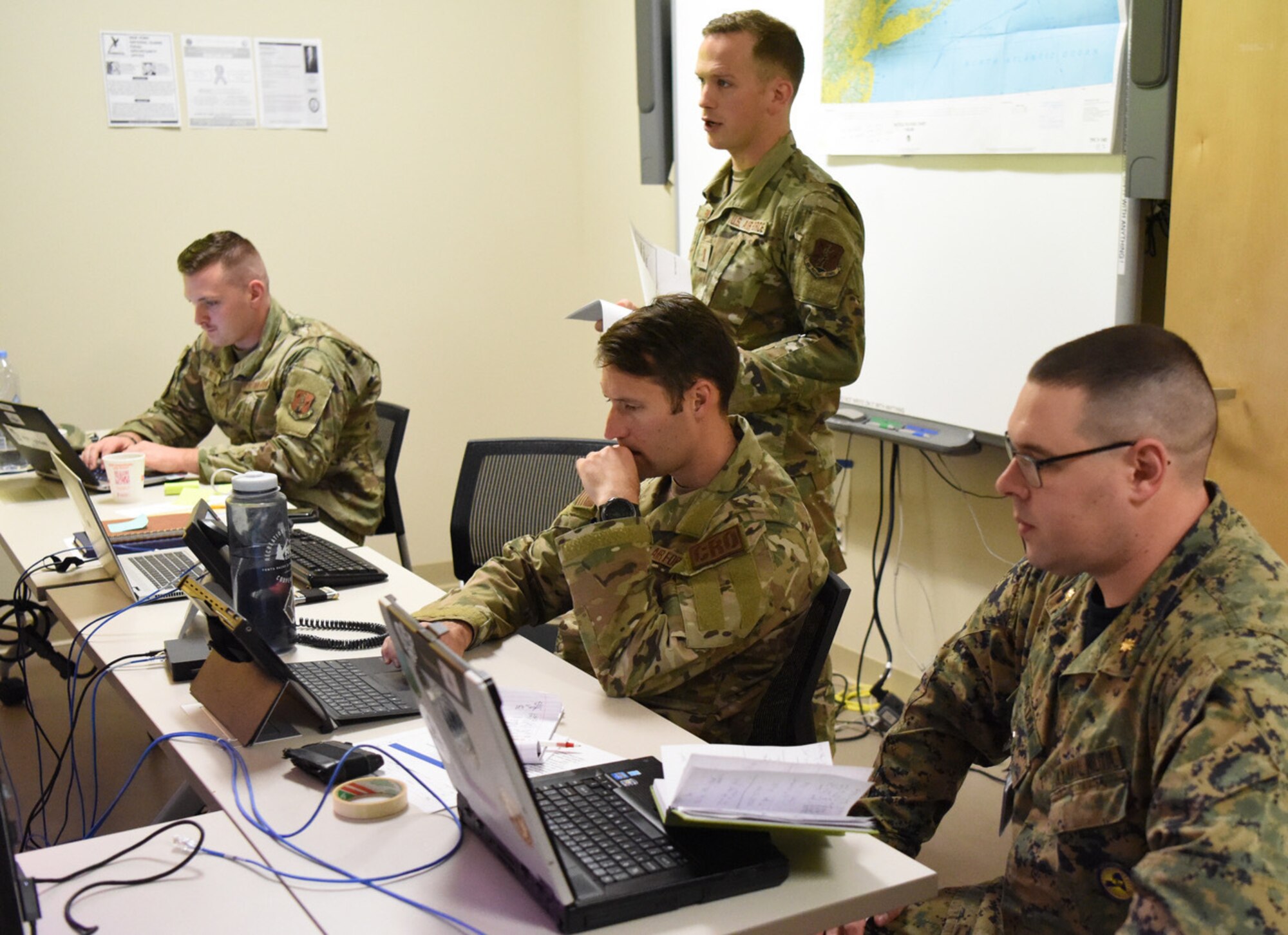 Members of the New York Air National Guard and New York Naval Militia, working in the Emergency Operations Center of Joint Exercise Hurricane Madison at F.S. Gabreski Air National Guard Base, N.Y., Nov. 5, 2022. 

The exercise is based on events from Super Storm Sandy, Tropical Storm Ida and Hurricane Gloria. (U.S. Air National Guard photo by Staff Sgt. Sean Madden)