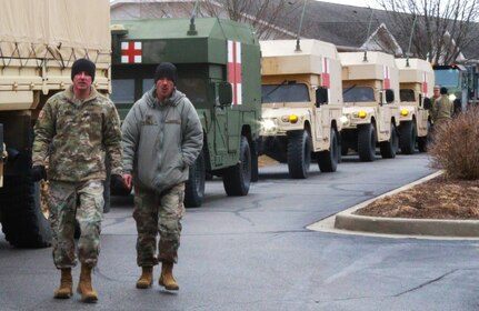 Illinois Army National Guard trucks line up prior to June's parade. 

The temperature was 23-degrees Fahrenheit, but it was a warm June Day in Auburn, Illinois, Dec. 17 as the Illinois National Guard joined hundreds of first responders and community groups from across the region to give 3-year-old June Peden-Stade a parade.  The Make A Wish Foundation reached out to the City of Auburn with June's wish this week and supporters flocked in from all over Central Illinois to make the parade a reality, including 10 trucks and about 20 Soldiers from the Illinois Army National Guard's 232nd Combat Sustainment Support Battalion; Charlie Company of the 634th Brigade Support Battalion; Battery B of the 2nd Battalion, 123rd Field Artillery; and the 3637th Maintenance Company - all based in Springfield.