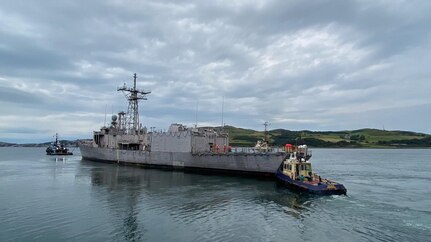 Ex-USS Boone (FFG 28) is towed from Campbeltown, Scotland, on Sept. 7, 2022, leaving port one final time prior to the sinking exercise. (U.S. Navy photo provided by Michael Kipp)