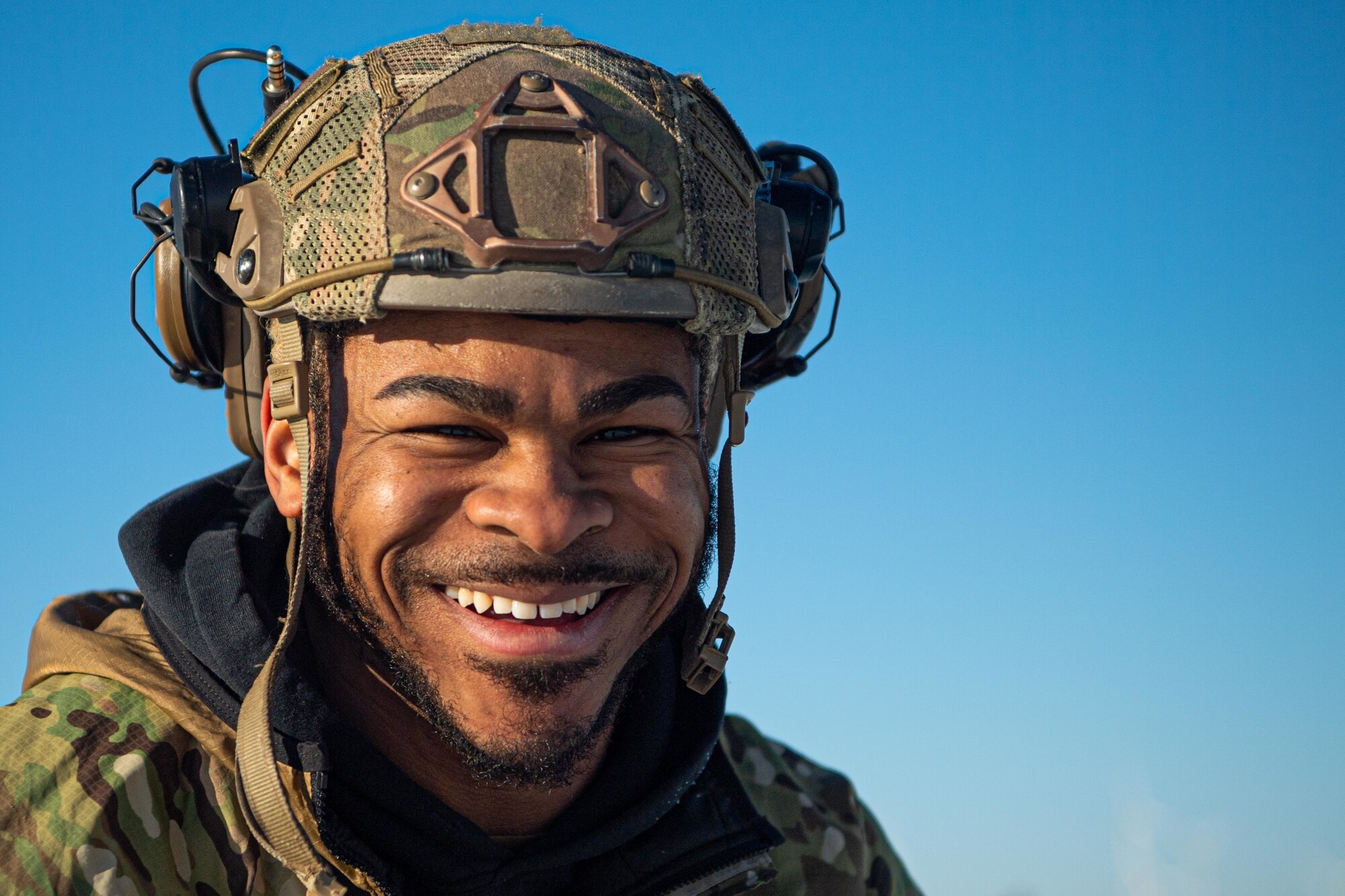 U.S. Air Force Staff Sgt. Dashuan Paper,  4th Air Support Operations Group Tactical Air Control Party Airman, smiles after completing a static-line jump