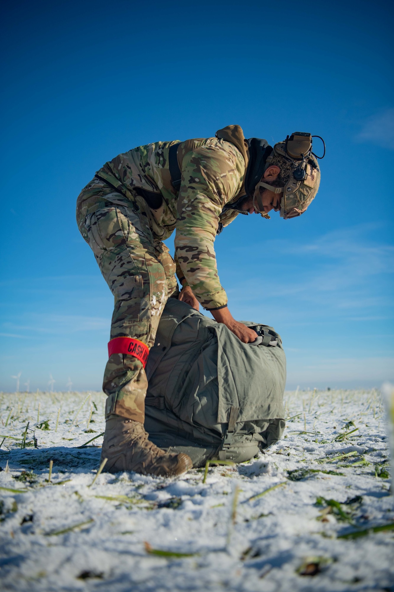 U.S. Air Force Staff Sgt. Dashuan Paper, 4th Air Support Operations Group tactical air control party Airman, packs a parachute