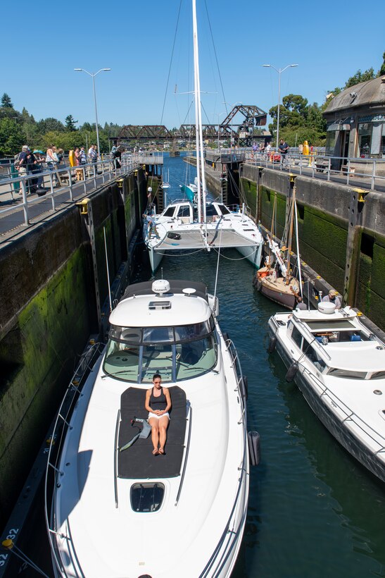 Recreational vessels wait to pass through the small lock at Lake Washington Ship Canal and Hiram M. Chittenden Locks, Seattle, Washington.