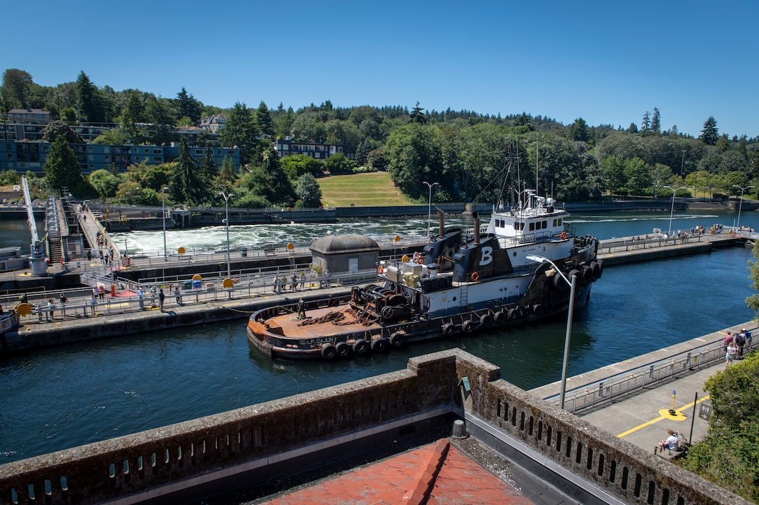 Photo of a commercial vessel names Gulf Cajun passing through the Lake Washington Ship Canal and Hiram M. Chittenden Locks.