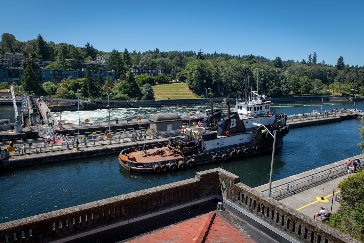 Photo of a commercial vessel names Gulf Cajun passing through the Lake Washington Ship Canal and Hiram M. Chittenden Locks.