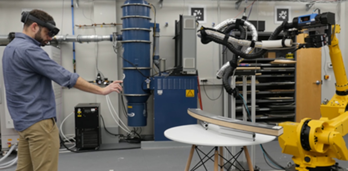 Titan Robotics, Inc. employee Justin Ivanco tests the augmented reality-enabled cold spray robot during system development in spring 2022 at Titan Robotics, Inc. headquarters, Pittsburgh, Pennsylvania. The system, which was installed at Warner Robins Air Logistics Complex at Robins Air Force Base, Georgia in late July 2022, has delivered significant cost savings to the Air Force, improved weapon system readiness, decreased maintenance downtime and improved material application accuracy. (Courtesy photo)