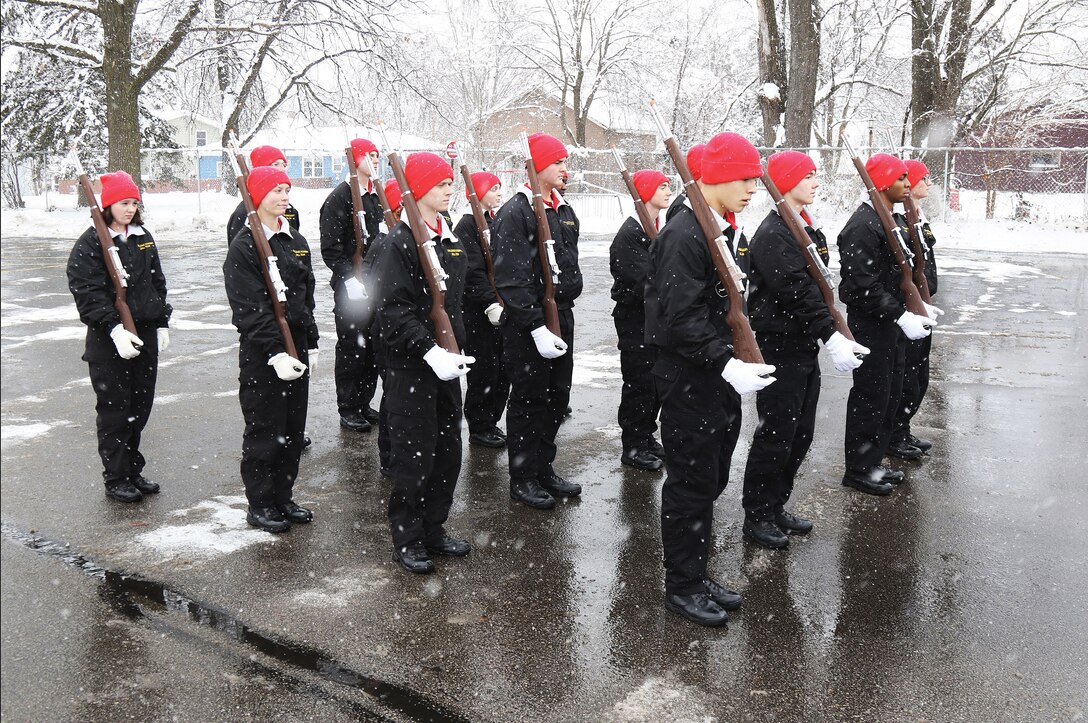 Graduating cadets display their drill and ceremony skills during an outdoor demonstration before the Wisconsin National Guard Challenge Academy graduation ceremony Saturday, Dec. 17 at Sparta High School, Sparta, Wis. After graduating from the 22-week residential phase of academy training, cadets work with hometown mentors who offer guidance and encouragement in pursuing their new direction in life. The National Guard Youth Challenge Program currently operates 40 programs in 29 states, Puerto Rico and the District of Columbia. Nationwide, more than 190,000 teens have graduated from this free program since its inception in 1993. Wisconsin National Guard photo by Staff Sgt. Alice Ripberger